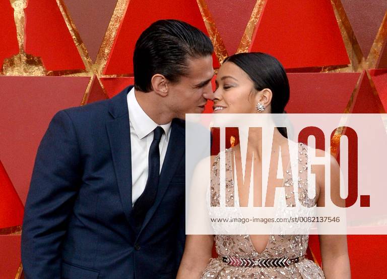 Actors Joe LoCicero (L) and Gina Rodriguez arrive on the red carpet for the 90th annual Academy Awards at the Dolby Theatre in the Hollywood section of Los Angeles on March 4, 2018. LAP20180304368 JIMxRUYMEN