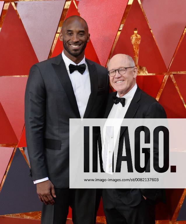 Basketball player Kobe Bryant (L) and director Glen Keane arrive on the red carpet for the 90th annual Academy Awards at the Dolby Theatre in the Hollywood section of Los Angeles on March 4, 2018. LAP20180304379 JIMxRUYMEN