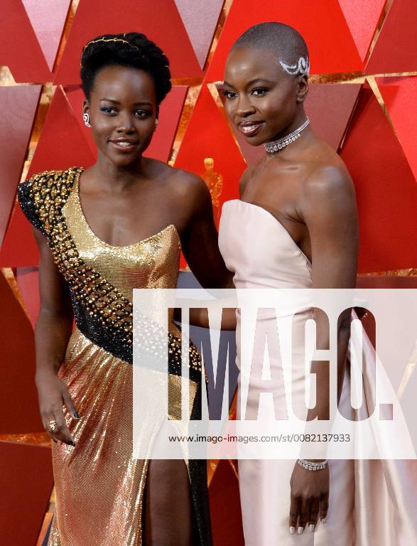 Actors Lupita Nyong o (L) and Danai Gurira arrive on the red carpet for the 90th annual Academy Awards at the Dolby Theatre in the Hollywood section of Los Angeles on March 4, 2018. LAP20180304395 JIMxRUYMEN