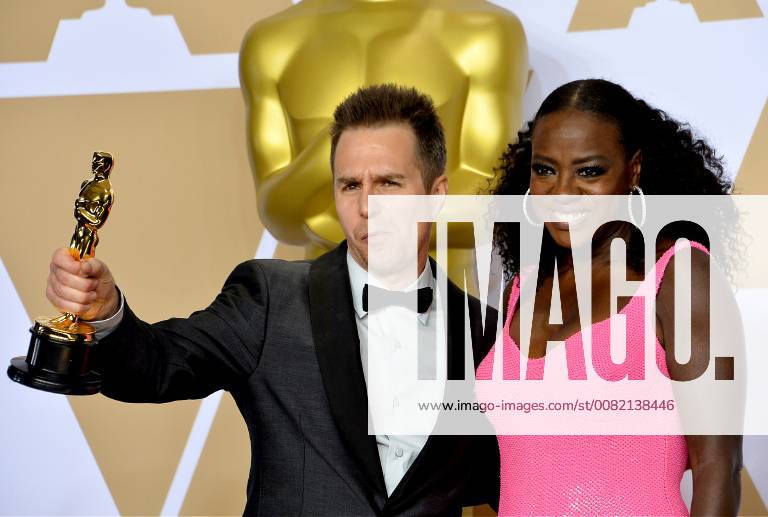 Actors Viola Davis (R) and Sam Rockwell, winner of the award for Best Supporting Actor for Three Billboards Outside Ebbing, Missouri, appears backstage with his Oscar during the 90th annual Academy Awards at Loews Hollywood Hotel in the Hollywood section of Los Angeles on March 4, 2018. LAP20180304903 JIMxRUYMEN