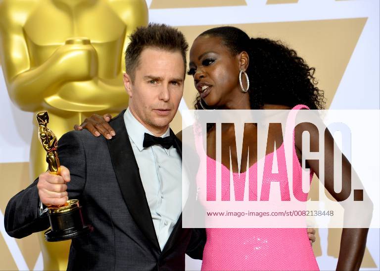 Actors Viola Davis (R) and Sam Rockwell, winner of the award for Best Supporting Actor for Three Billboards Outside Ebbing, Missouri, appears backstage with his Oscar during the 90th annual Academy Awards at Loews Hollywood Hotel in the Hollywood section of Los Angeles on March 4, 2018. LAP20180304908 JIMxRUYMEN