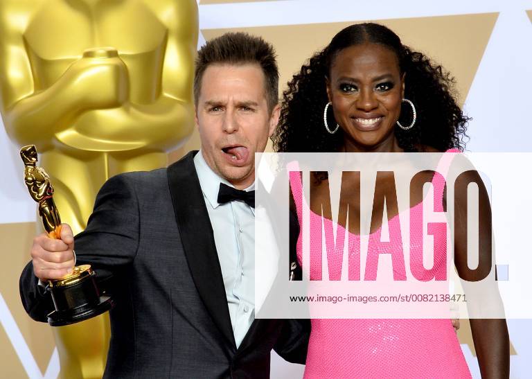 Actors Viola Davis (R) and Sam Rockwell, winner of the award for Best Supporting Actor for Three Billboards Outside Ebbing, Missouri, appears backstage with his Oscar during the 90th annual Academy Awards at Loews Hollywood Hotel in the Hollywood section of Los Angeles on March 4, 2018. LAP20180304907 JIMxRUYMEN