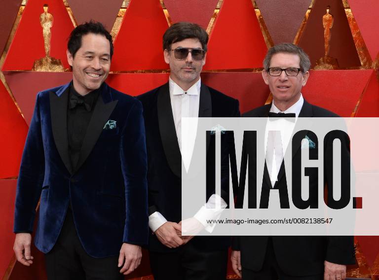 Production designer Paul Denham Austerberry (L) and set decorators Shane Vieau (C) and Jeffrey A. Melvin arrive on the red carpet for the 90th annual Academy Awards at the Dolby Theatre in the Hollywood section of Los Angeles on March 4, 2018. LAP20180304495 JIMxRUYMEN