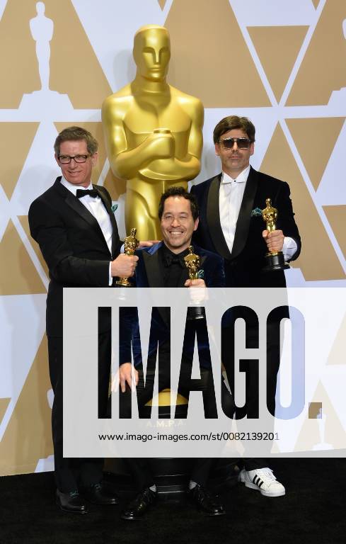 (L-R) Set decorator Jeffrey A. Melvin, production designer Paul Denham Austerberry, and set decorator Shane Vieau, winners of the Best Production Design award for The Shape of Water, appear backstage with his Oscar during the 90th annual Academy Awards at Loews Hollywood Hotel in the Hollywood section of Los Angeles on March 4, 2018. LAP20180304996 JIMxRUYMEN