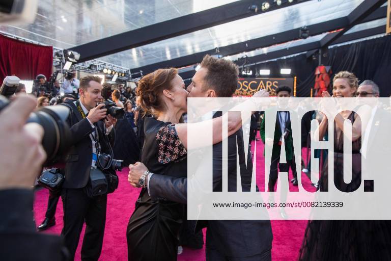 Hollywood, California, U.S. - Oscar-nominee Sam Rockwell greets producer Jennifer Todd while guest Leslie Bibb looks on at the live ABC Telecast of The 90th Oscars at the Dolby Theatre in Hollywood. Hollywood U.S. - ZUMAz03_ 20180304_shf_z03_321