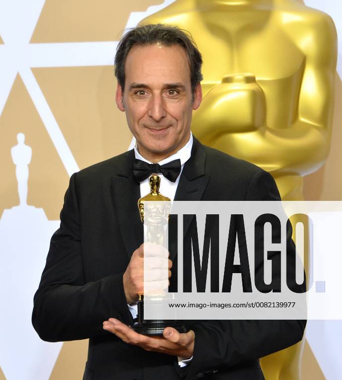 Composer Alexandre Desplat, winner of the award for Best Original Score award for The Shape of Water, appears backstage with his Oscar during the 90th annual Academy Awards at Loews Hollywood Hotel in the Hollywood section of Los Angeles on March 4, 2018. LAP201803041070 JIMxRUYMEN