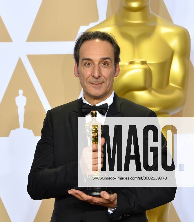Composer Alexandre Desplat, winner of the award for Best Original Score award for The Shape of Water, appears backstage with his Oscar during the 90th annual Academy Awards at Loews Hollywood Hotel in the Hollywood section of Los Angeles on March 4, 2018. LAP201803041071 JIMxRUYMEN