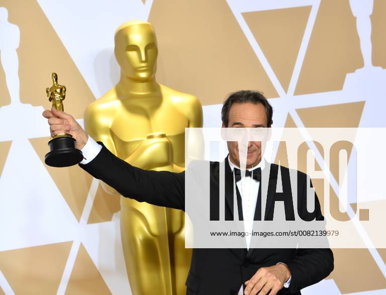 Composer Alexandre Desplat, winner of the award for Best Original Score award for The Shape of Water, appears backstage with his Oscar during the 90th annual Academy Awards at Loews Hollywood Hotel in the Hollywood section of Los Angeles on March 4, 2018. LAP201803041074 JIMxRUYMEN