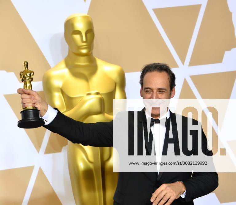 Composer Alexandre Desplat, winner of the award for Best Original Score award for The Shape of Water, appears backstage with his Oscar during the 90th annual Academy Awards at Loews Hollywood Hotel in the Hollywood section of Los Angeles on March 4, 2018. LAP201803041075 JIMxRUYMEN