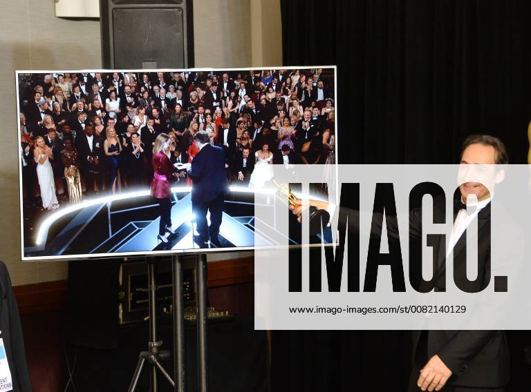 Composer Alexandre Desplat, winner of the award for Best Original Score award for The Shape of Water, appears backstage with his Oscar during the 90th annual Academy Awards at Loews Hollywood Hotel in the Hollywood section of Los Angeles on March 4, 2018. LAP201803041080 JIMxRUYMEN