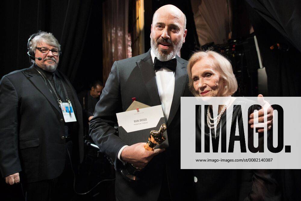 Mark Bridges poses backstage with Eva Marie Saint and the Oscar for Achievement in costume design, for work on Phantom Thread during the live ABC Telecast of The 90th Oscars® at the Dolby® Theatre in Hollywood, CA on Sunday
