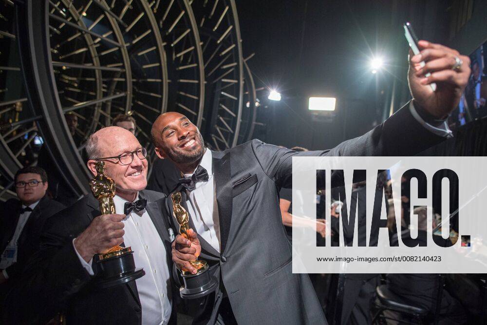 Glen Keane and Kobe Bryant pose backstage with the Oscar for best animated short film, for work on Dear Basketball during the live ABC Telecast of The 90th Oscars® at the Dolby® Theatre in Hollywood, CA on Sunday