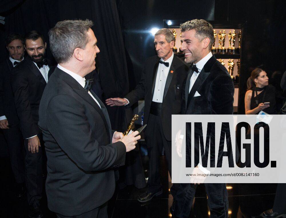 Lee Unkrich, Oscar winner for best animated feature film for work on Coco, and Oscar Isaac chat backstage with the during the live ABC Telecast of The 90th Oscars® at the Dolby® Theatre in Hollywood, CA on Sunday