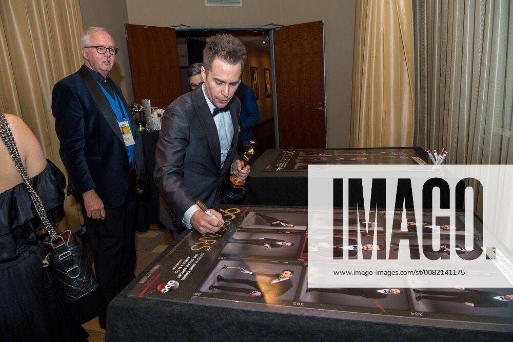 Sam Rockwell signs a poster backstage with the Oscar for performance by an actor in a supporting role for work on Three Billboards Outside Ebbing, Missouri during the live ABC Telecast of The 90th Oscars® at the Dolby® Theatre in Hollywood, CA on Sunday