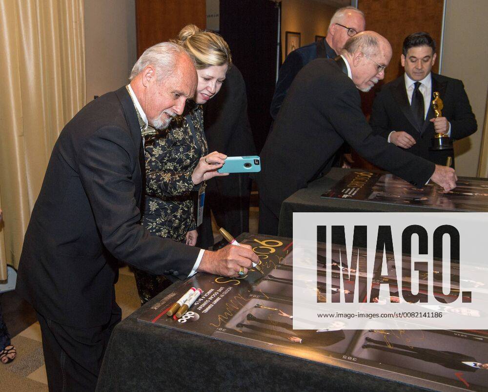 Gregg Landaker signs a poster backstage with the Oscar for achievement in sound mixing for work on Dunkirk during the live ABC Telecast of The 90th Oscars® at the Dolby® Theatre in Hollywood, CA on Sunday