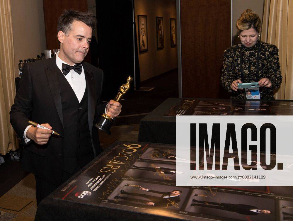 Sebastian Lelio signs posters backstage with the Oscar for best foreign language film for work on A Fantastic Woman from Chile during the live ABC Telecast of The 90th Oscars® at the Dolby® Theatre in Hollywood, CA on Sunday