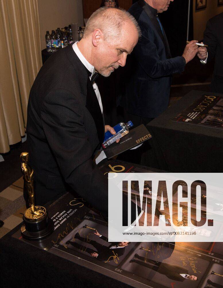 John Nelson signs posters backstage with the Oscar for achievement in visual effects for work on Blade Runner 2049 during the live ABC Telecast of The 90th Oscars® at the Dolby® Theatre in Hollywood, CA on Sunday