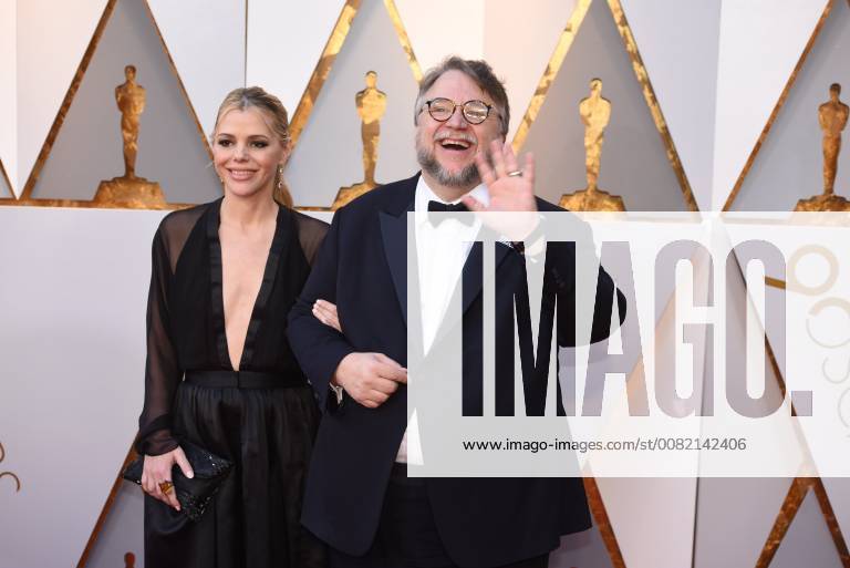 Los Angeles, California, U.S. - GUILLERMO DEL TORO, right, who arrives with Screenwriter KIM MORGAN on the red carpet for the 90th Annual Academy Awards at the Dolby Theatre. Del Toro, won a Best Director Oscar for The Shape of Water. Los Angeles U.S. - ZUMAz03_ 20180304_zbp_z03_155