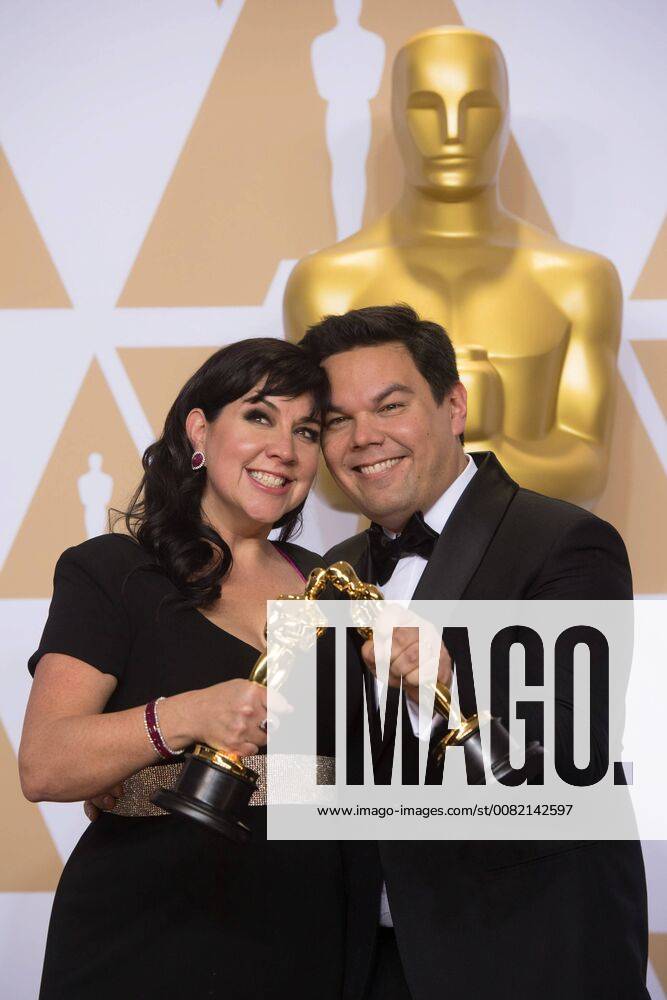 After winning the Oscar for music written for motion pictures (original song) for Remember Me from Coco, Kristen Anderson-Lopez and Robert Lopez pose backstage during the live ABC Telecast of The 90th Oscars® at the Dolby® Theatre in Hollywood, CA on Sunday
