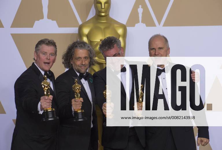 Hollywood, California, U.S - Richard R. Hoover, Paul Lambert, Gerd Nefzer, and John Nelson, winners of the Best Visual Effects award for Blade Runner 2049, pose in the press room during the 90th Annual Academy Awards held at the Loews Hollywood Hotel on Sunday March 4, 2018 in Hollywood, California. Hollywood U.S. - ZUMAp124 20180304_zaa_p124_245