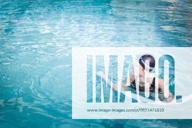 Woman floating with foam noodle in pool wearing black swimsuit, swim cap, blue goggles, copy space Woman floating with foam noodle in pool wearing black swimsuit, swim cap, blue goggles, copy space. Fitness, leisure, aquatic, relaxation, wellness, summer, lifestyle, model released, , property released, , 11.10.2015, 6299594.jpg, people,foam noodle,pool,swimming,woman,black swimsuit,swim cap,blue goggles,white female,floating,fitness,leisure,aquatic,relaxation,wellness,summer,lifestyle,young adult,water,clear,turquoise,ripples,holding,kicking,smiling,one-piece swimsuit,recreation,swimmer,sport,health,exercise,water sport,calm,aquatic exercise,buoyant,bright,sunlight,wellness activity,personal care,casual,water surface,horizontal,copy space,
