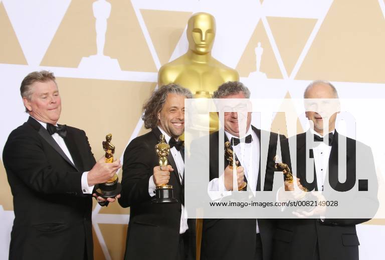 HOLLYWOOD, CA - MARCH 4: Richard R. Hoover, Paul Lambert, Gerd Nefzer, John Nelson, in the press room at the 90th Academy Awards at the Dolby Theatre in Hollywood, California on March 4, 2018.