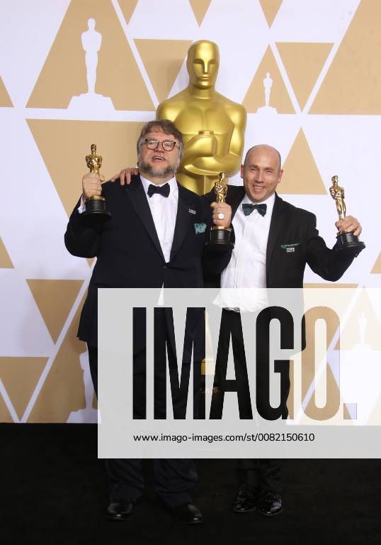 HOLLYWOOD, CA - MARCH 4: Guillermo del Toro, J. Miles Dale, in the press room at the 90th Academy Awards at the Dolby Theatre in Hollywood, California on March 4, 2018.