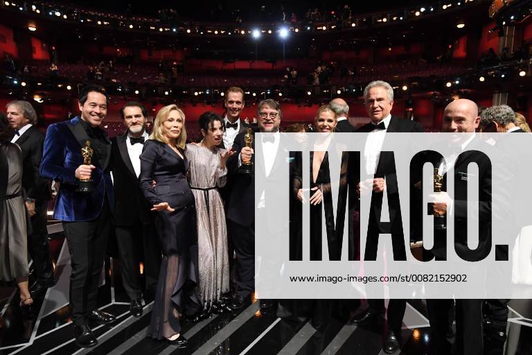 Paul Denham Austerberry, guest, Faye Dunaway, Sally Hawkins, Doug Jones, Guillermo del Toro, guest, Warren Beatty and J. Miles Dale pose on stage during The 90th Oscars® at the Dolby® Theatre in Hollywood, CA on Sunday