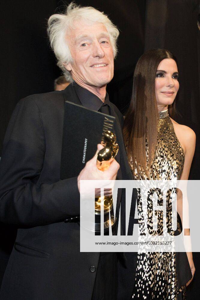Sandra Bullock with Roger A. Deakins as he poses backstage with the Oscar for achievement in cinematography for work on Blade Runner 2049 during the live ABC Telecast of The 90th Oscars® at the Dolby® Theatre in Hollywood, CA on Sunday