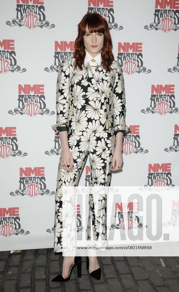 The NME Awards 2012 Florence Welch of Florence and The Machine attended the NME Awards 2012, O2 Academy Brixton, Stockwell Rd., London, England February 29th, 2012 full length black white playsuit floral print CAP CAN Can Nguyen London UK Great Britain