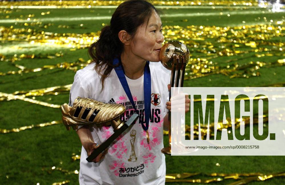 Japan s Homare Sawa (JPN) celebrates with a kiss the win of the victory during the final match of the Women s Soccer World Cup in Frankfurt