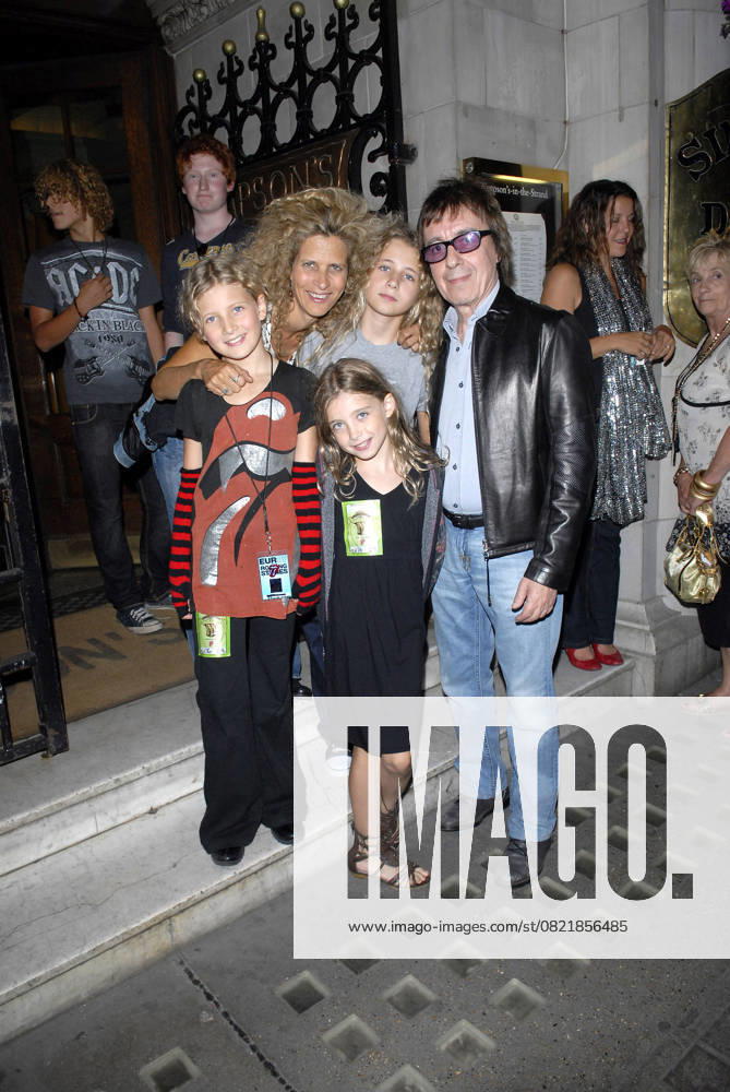 Rolling Stones After Show Party BILL WYMAN & FAMILY At the Rolling Stones After Show Party, The Strand, London, England, August 27th 2007. Full length band music wife children black leather jacket glasses jeans CAP FIN Steve Finn London Great Britain