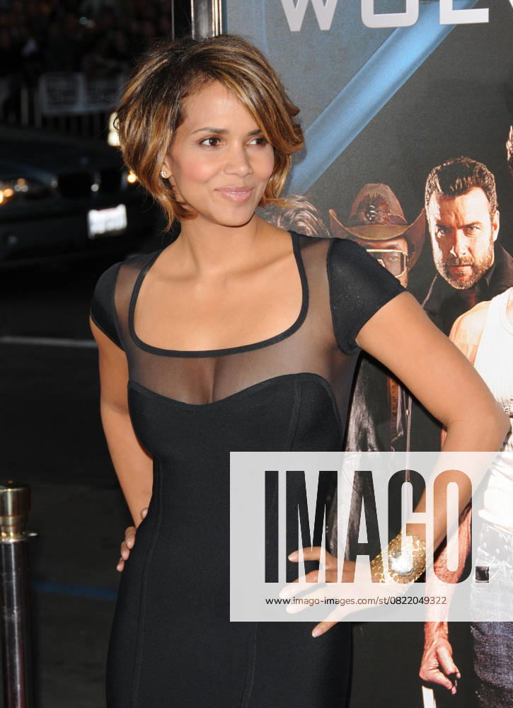 L.A. Screening of X-Men Origins - Wolverine Hollywood HALLE BERRY The Twentieth Century Fox L.A. Screening of X-Men Origins: Wolverine held at The Grauman s Chinese Theatre in Hollywood, California, USA. April 28th, 2009 half length hands on hips tight black sheer see through thru bob highlight gold cuff bracelet dress cleavage 3 4 CAP DVS Debbie VanStory Los Angeles California United States