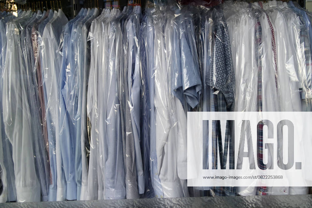 Mens shirts cleaned and ironed in plastic wrap in a dry cleaners in Düsseldorf Mörsenbroich