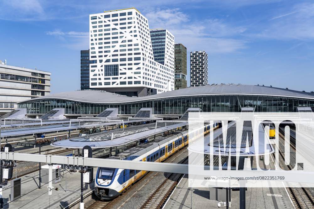 The central station Utrecht Centraal, tracks and station concourse, trains of the Nederlandse Spoorwegen N V state railroad company, office building in the city center, Netherlands Utrecht Centraal
