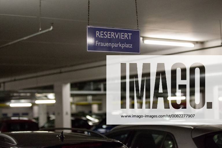 Schild Reserviert Woman parking space above a car parking space with parked cars in a parking garage with little light Theme picture Symbolbild Parking garage Frauenparkplatz 13 02 18 Essen NRW Germany