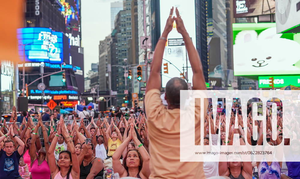 People gather to celebrate the summer solstice in Times Square and the UN NEW YORK CITY, UNITED STATES - JUNE 21: People participate in free yoga practice at the United Nations and Times Square on Friday, June 20, to celebrate June 21 International Day of Yoga and the summer solstice, marking the longest day of the year. Selcuk Acar Anadolu New York United States. Editorial use only. Please get in touch for any other usage.
