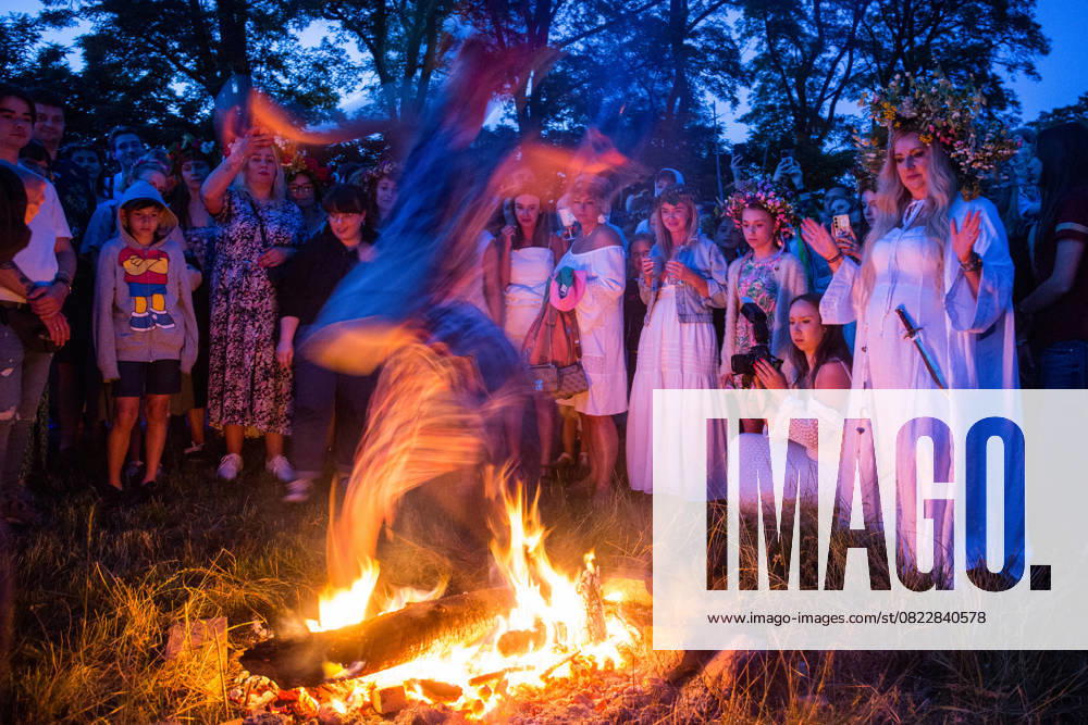 Kupala Night on the Odra River in Cigacice, Poland - 21 Jun 2025 A woman is jumping over a bonfire during the Kupala Night celebrations. Kupala Night (Polish: Noc Kupa³y) is an old Slavic holiday celebrated on the night of the summer solstice. It combines the cult of nature, fertility, fire and water. Cigacice Poland