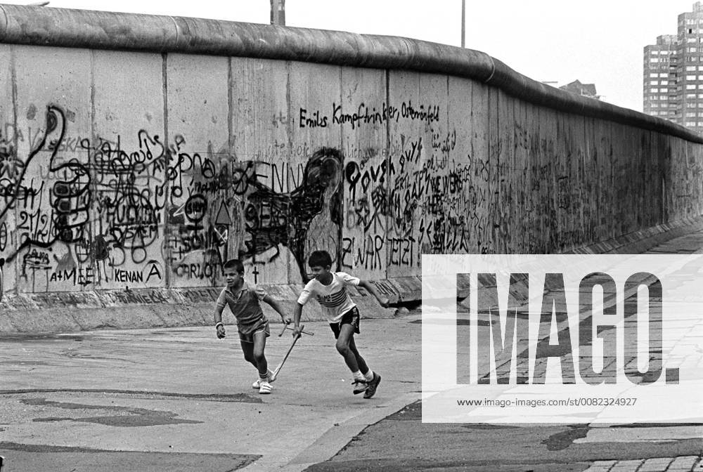 Berlin Wall in Kreuzberg 1986 Children play at the Berlin Wall in Berlin Kreuzberg