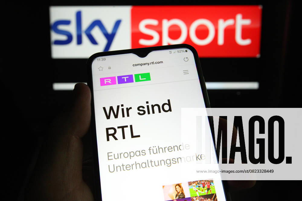 The RTL Group website was called up on a smartphone Behind it, the logo of the Sky Sport broadcasting group was called up on a laptop On Friday it was announced that RTL Deutschland is buying Sky Deutschland This will create a new streaming giant Symbol image Symbol photo Schnelsen Hamburg