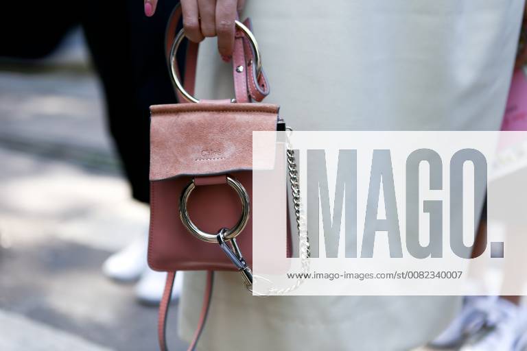 A chic showgoer posing outside the Dolce & Gabbana runway show during Milan Fashion Week - Sept 24, 2017 - MFW: Spring 2018 Street Style Day 5,