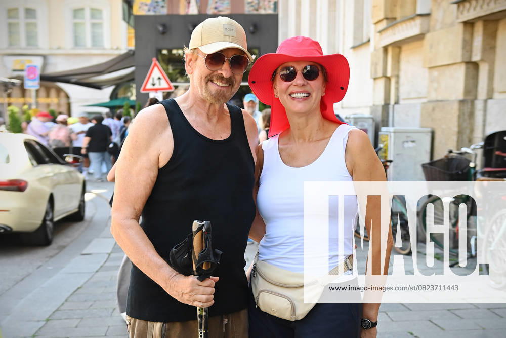 While strolling in Munich Thomas GOTTSCHALK caught with his wife Karina in a muscle shirt and with Nordic Walking sticks on the Promenadeplatz ZDF Reception Get Totgether Orange Hour in Hugo s Bar on the occasion of Filmfest Muenchen on 01 07 2025