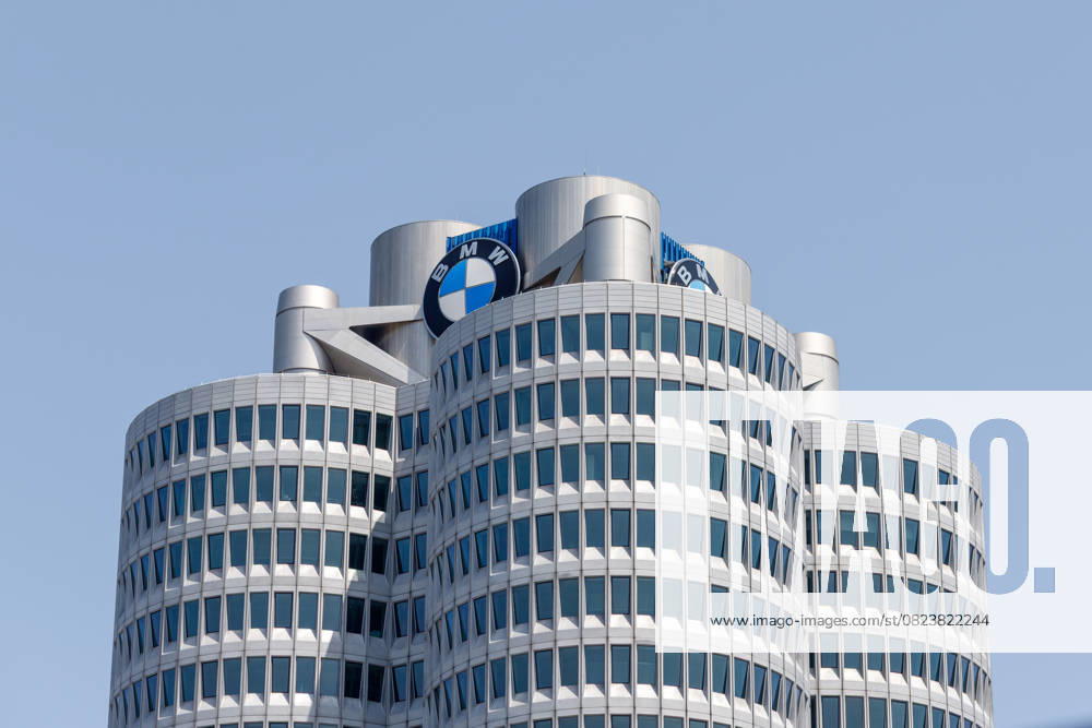 Munich, Germany 14 June 2025 Close-up of Building the BMW Head office in Munich with his unique Four-cylinder Design and the BMW Logo before a clear blue Sky 1127501002