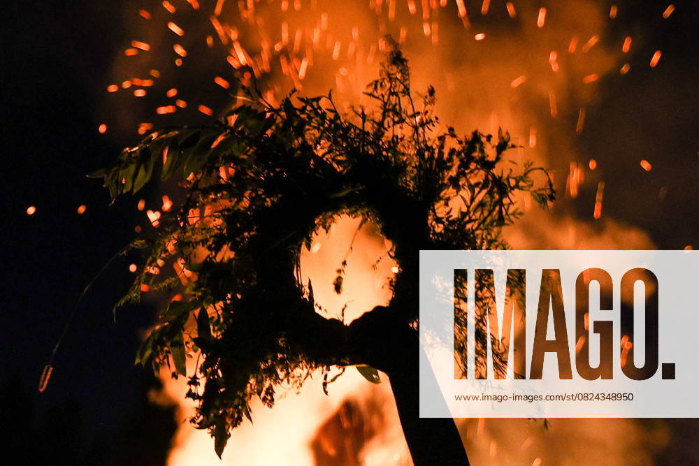RUSSIA, MOSCOW REGION - JULY 5, 2025: A flower crown is seen in front of a bonfire during festivities marking Ivan Kupala Day, a pagan summer solstice celebration, at the Vasilkovoye Ozero holiday park. Valeria Kalugina TASS 82256444