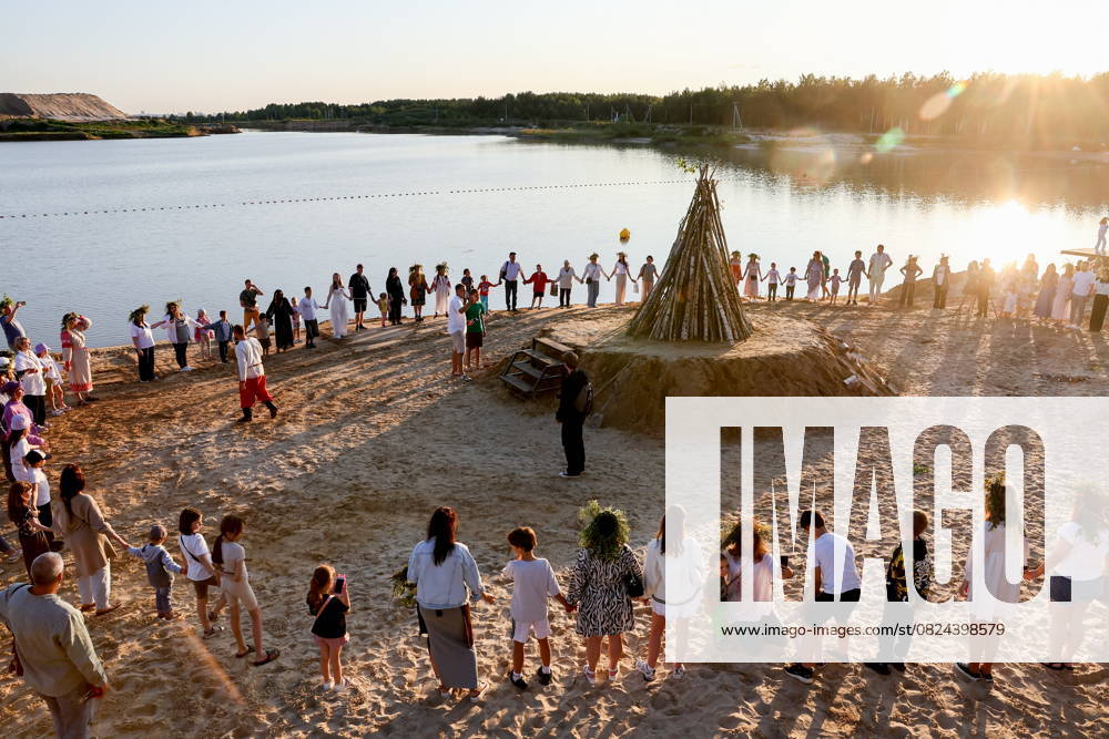 RUSSIA, RYAZAN REGION - JULY 5, 2025: People dance around a bonfire during a celebration marking Ivan Kupala Day at Akvamarin Holiday Centre. Alexander Ryumin TASS 82265239