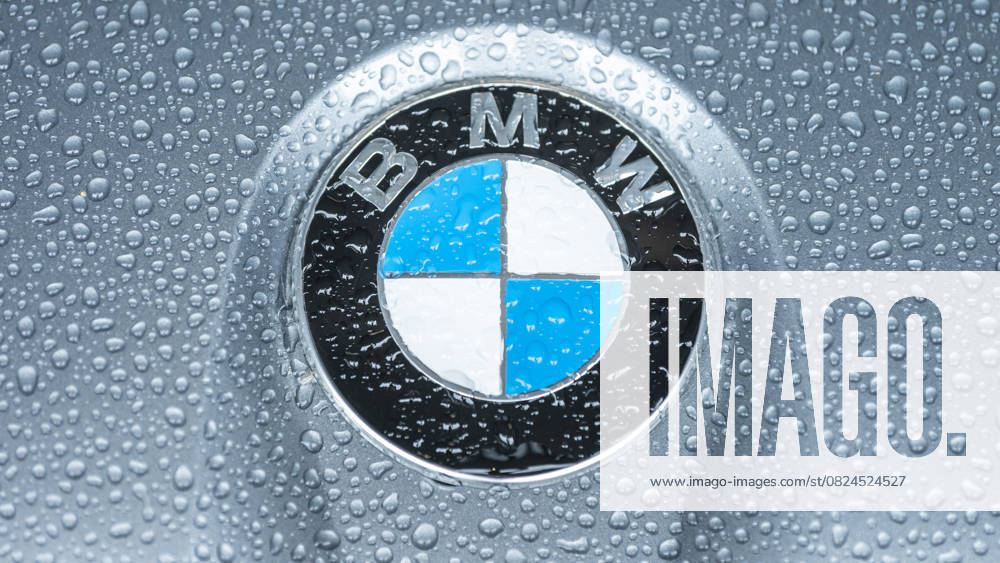 The logo of the car manufacturer BMW can be seen on a BMW M2 G87 standing in the rain Nürburg Rhineland-Palatinate Germany
