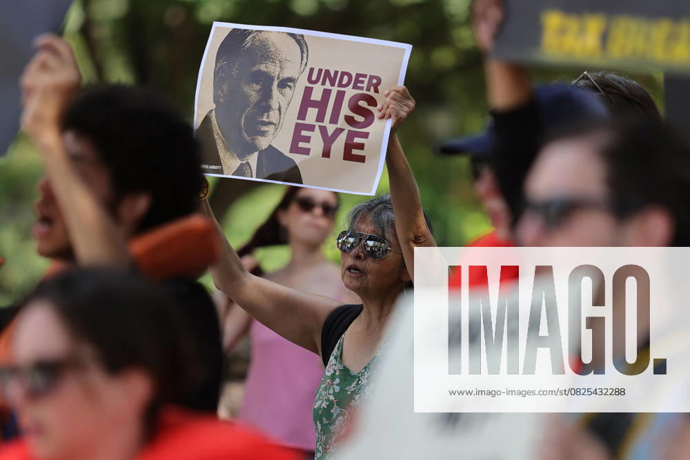 KW28 Demonstrators Call Out Texas Government Failures Following Deadly Floods Protestors gather outside the Texas State Capitol Building in Austin, Texas, on July 12, 2025. A protestor holds a sign depicting the Texas state governor with the words, under his eye. Austin, Texas Texas United States