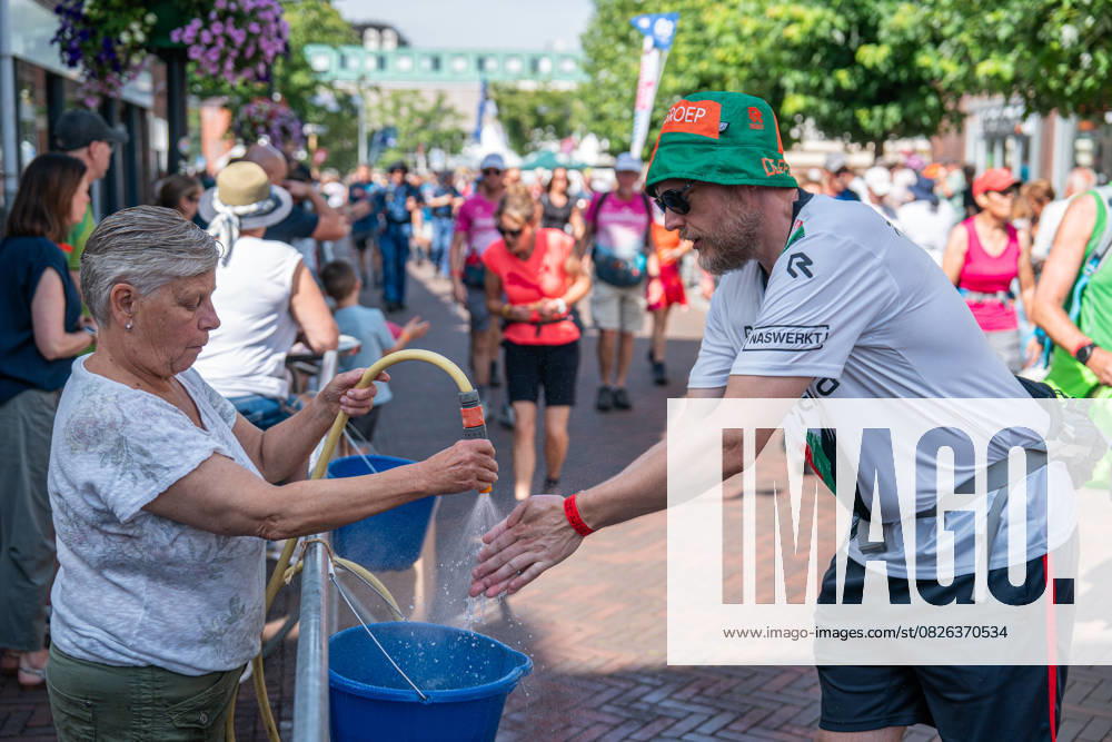 2025-07-18 Day 4 Four Days Marches Nijmegen CUIJK, NETHERLANDS - JULY 18: Day 4 of the Four Day Marches (Vierdaagse 4daagse), the world s biggest multi-day walking event with about 47.000 participants. Photo depicts a walker washing his hands. On July 18, 2025 in Cuijk, Netherlands. Cuijk Netherlands Content not available for redistribution in The Netherlands directly or indirectly through any third parties.