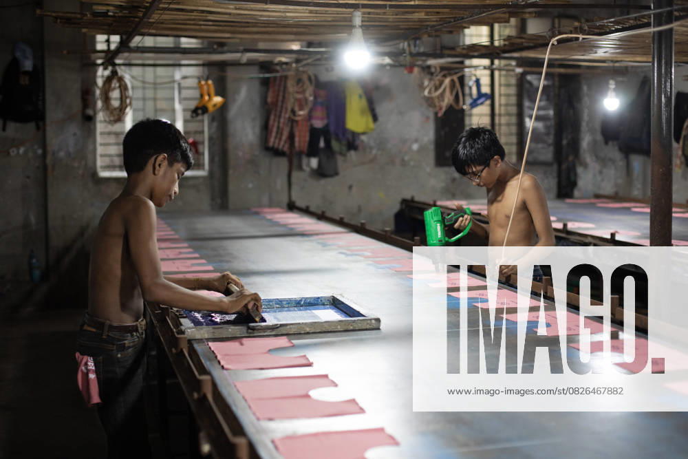 Underage Workers In A Local Printing Factory Child laborers work in a local printing factory for clothes in Narayanganj, Bangladesh, on July 19, 2025. Narayanganj Bangladesh