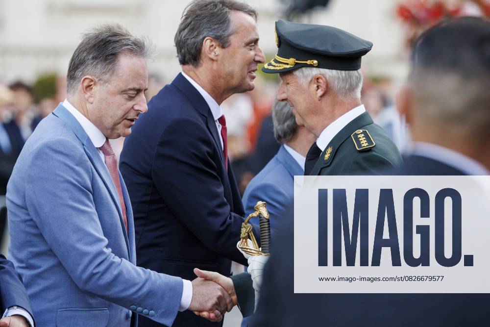 Prime Minister Bart De Wever and King Philippe - Filip of Belgium pictured during the military and civilian parade on the Belgian National Day, in Brussels, Monday 21 July 2025. This parade pays tribute to our country s security and emergency services, such as the army, police, fire brigade or civil protection. POOL NICOLASxMAETERLINCK 129720422